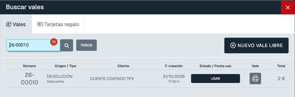 Buscador de vales del TPV con el vale 26-00010, origen DEVOLUCIÓN, botón USAR, icono de impresión y total de 2 euros